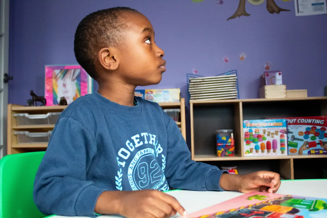 Photo of boy looking upwards.